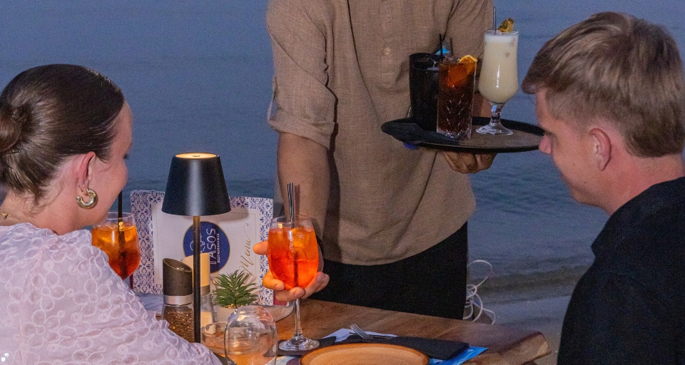 Relaxing beachfront dining and sunbed cocktail service at Tasos Beach Bar Laganas